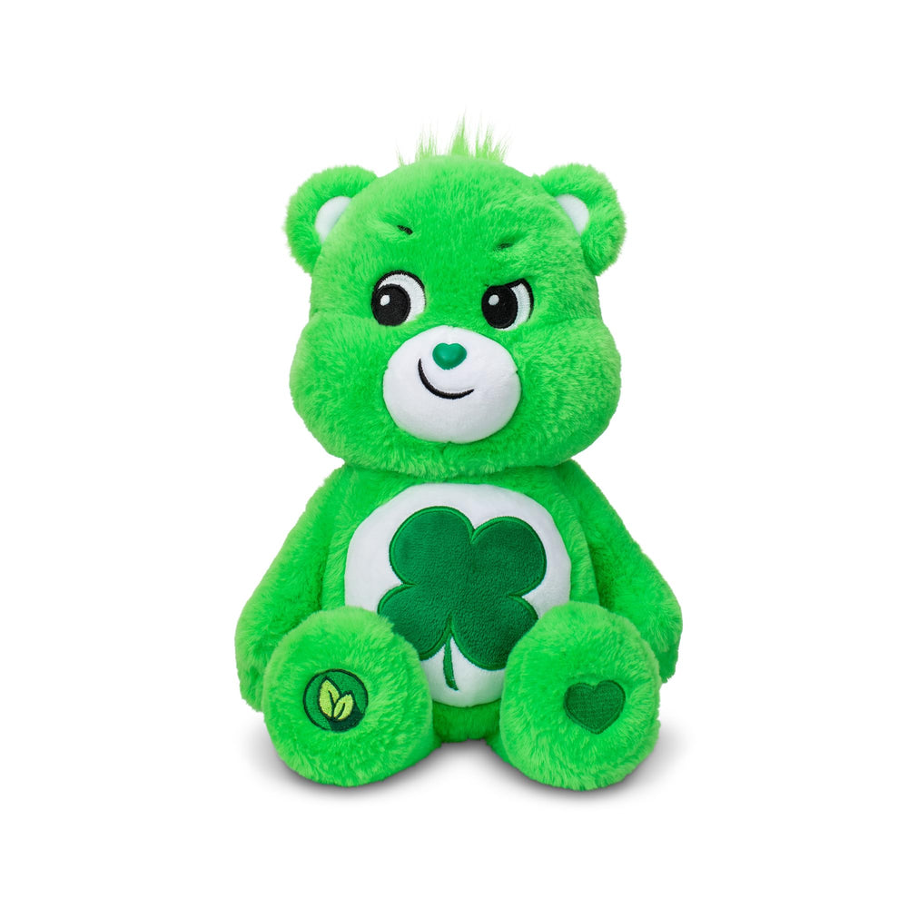 Care Bears Good Luck Bear plush lying down for cozy hugs and friendly vibes.