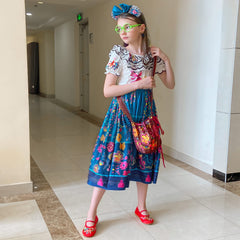 CCJRLM Encanto dress lantern sleeves showing playful movement.