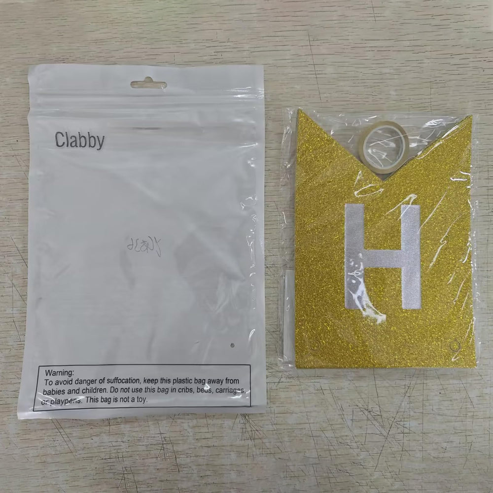 Clabby glitter gold banner wall display enhancing party ambiance.