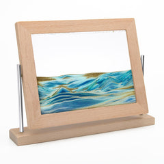 Coitak moving sand art picture with swirling clouds for a calming desk focal point.