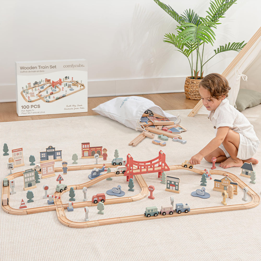 Comfy Cubs 100-piece train set tracks, showcasing an inviting wooden layout for toddlers