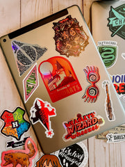 CON*QUEST crookshanks sticker on a laptop sleeve