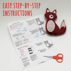 Kid sewing a woodland animal with clear CraftLab instructions.