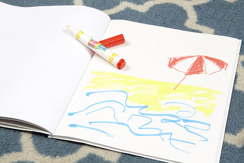 Child coloring with Crayola Color Wonder on special paper, reducing mess