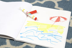 Child coloring with Crayola Color Wonder on special paper, reducing mess