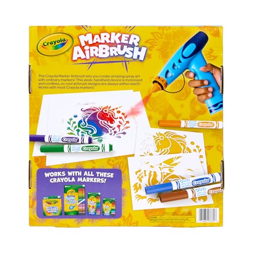 Airbrush in action showing downward spray for controlled effects