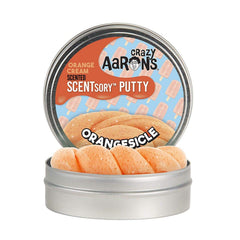 Crazy Aaron's Thinking Putty Orangesicle bottle enhances focus and stress relief via tactile play.