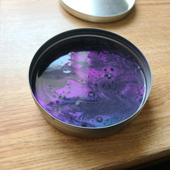 Close-up of color-shifting metallic blue, purple, copper, and red in Crazy Aaron's Super Scarab