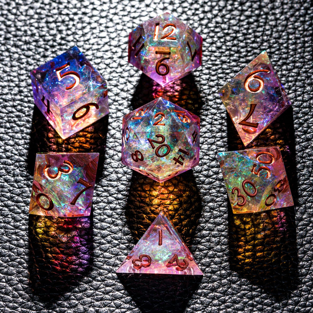CRITALLIC 7-piece DND dice set close-up highlights transparent sharp edges and vivid purple-orange hues.