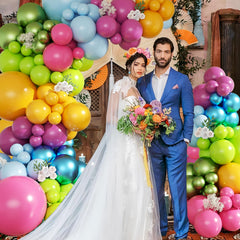 CROSSFINGERS 145pcs rainbow balloon garland used as a bright party backdrop.
