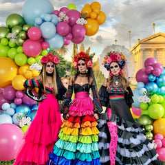 CROSSFINGERS balloons in 18, 10, and 5 inch sizes form a layered arch.