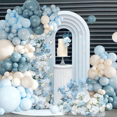 CROSSFINGERS blue and white balloon arch assembly as baby shower backdrop.