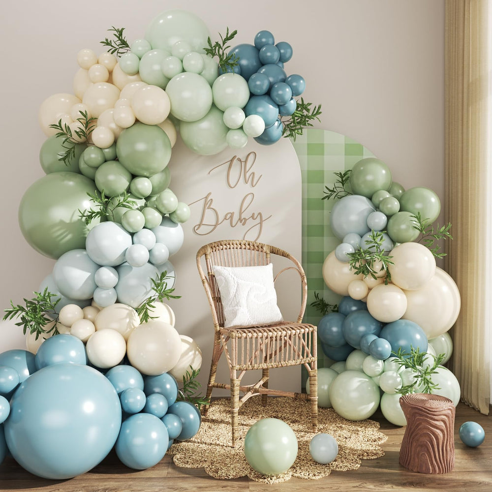Crossfingers balloon arch kit assembled in dusty blue and sage green for a dramatic backdrop.