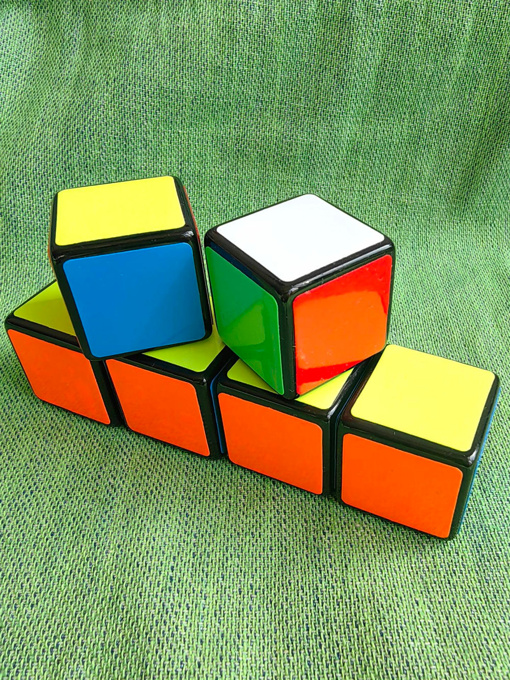 Cuberspeed 1x1x1 speed cube held in hand for on-the-go solving.