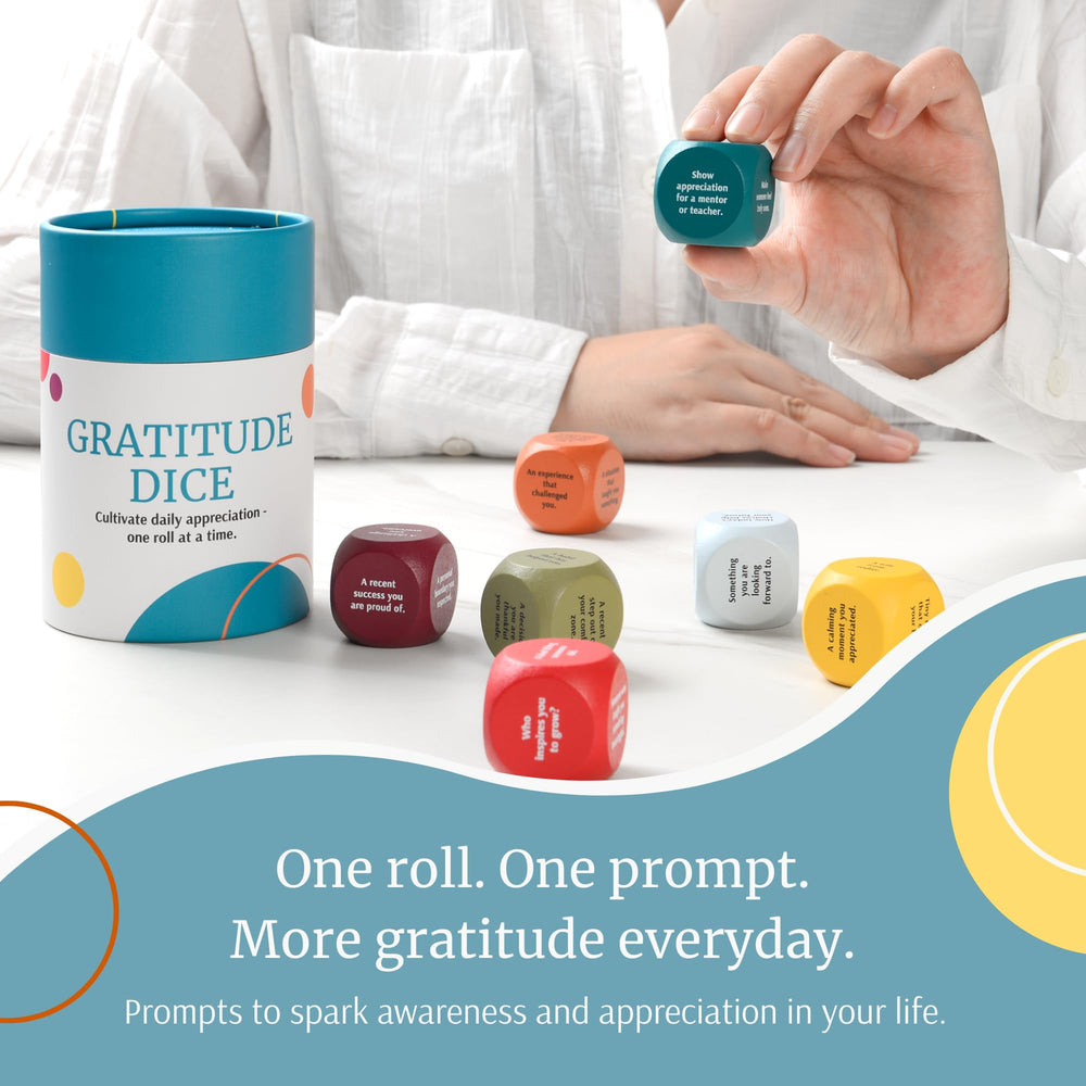 Curiosity Driven Gratitude Dice Set in cylindrical packaging for gift-ready presentation.