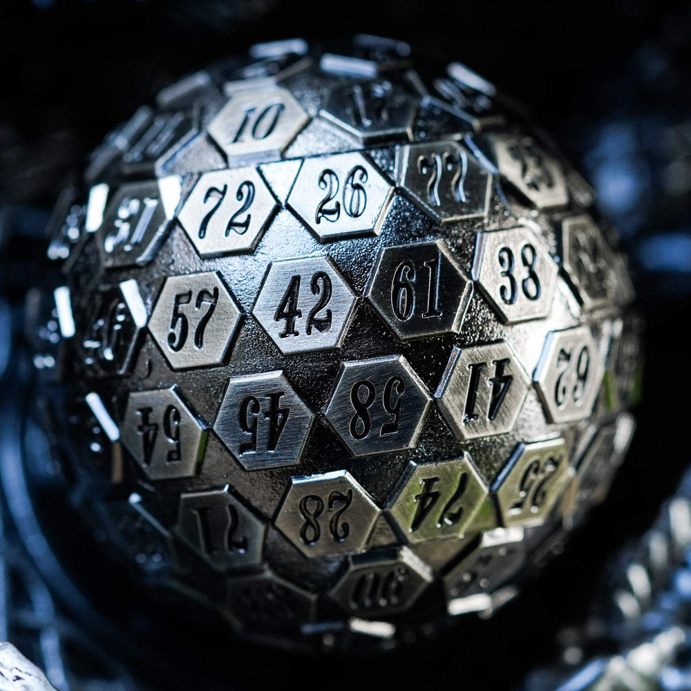 Cusdie D100 heavy, well-balanced metal dice held in hand for precise rolls