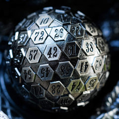 Cusdie D100 heavy, well-balanced metal dice held in hand for precise rolls