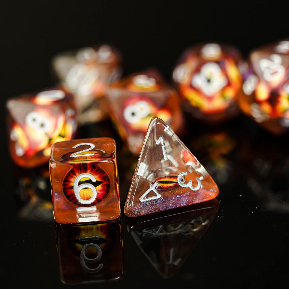Cusdie eyeball dice on table during a night session.