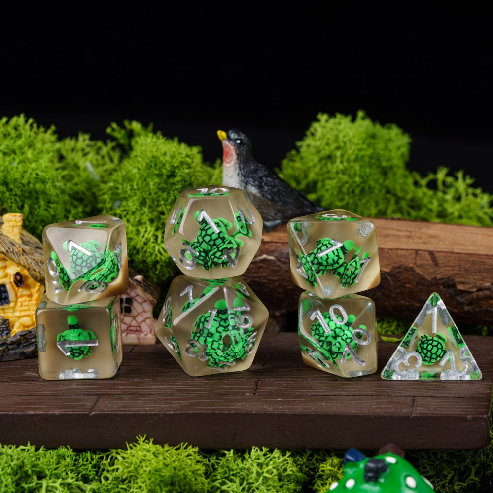 Cusdie turtle-encased dice photographed with packaging and branding clearly visible.