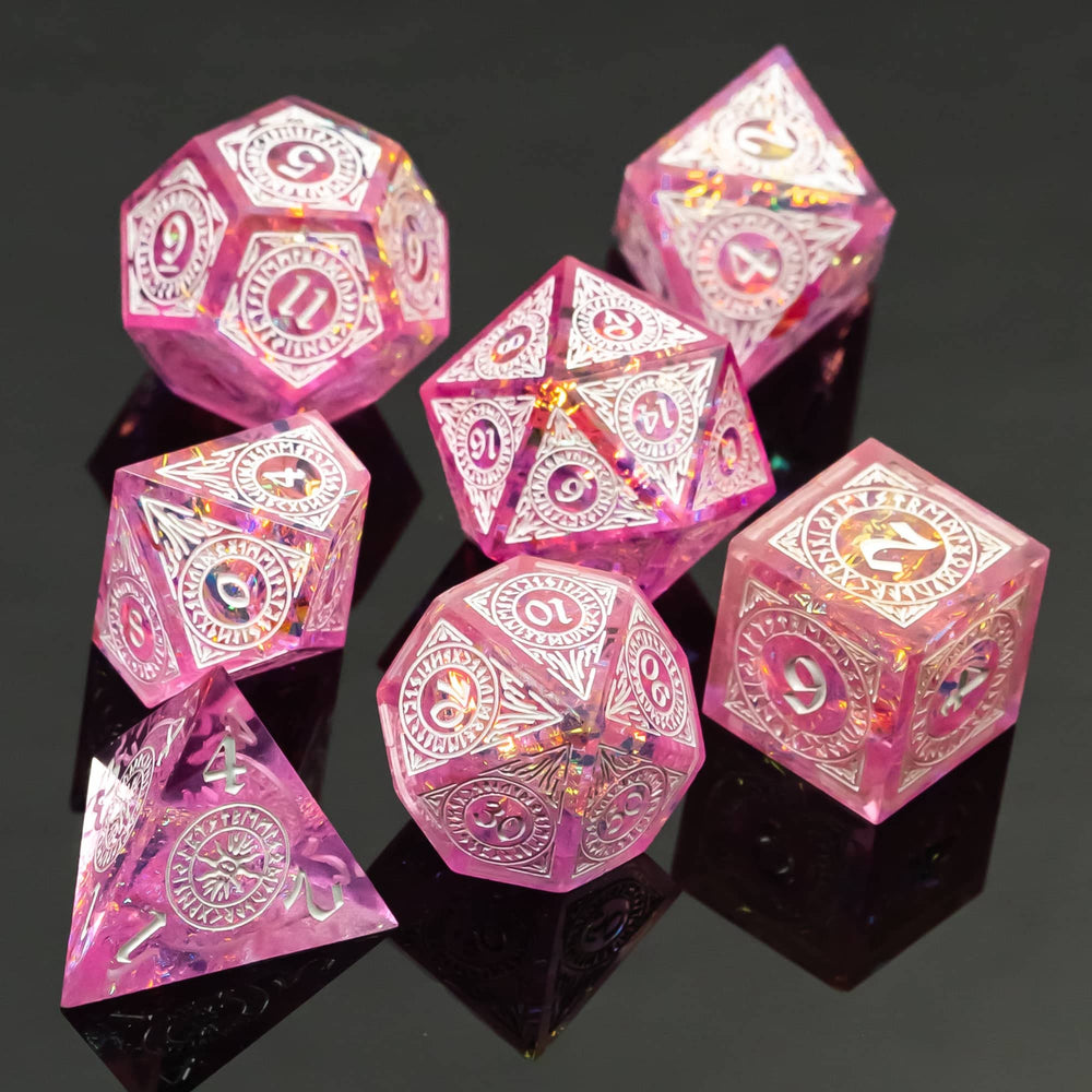 Cusdie hand-poured resin dice with glitter foil in pink, catching light beautifully.