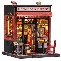 The CUTEBEE Uncle Joe's Pizzeria book nook kit on a shelf with warm glow