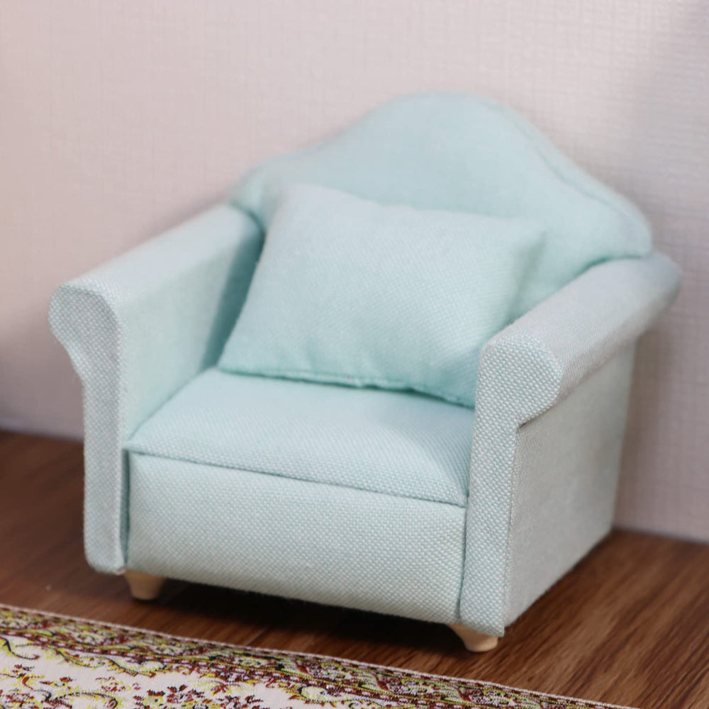 Cutemini couch close-up reveals detailed fabric texture and colorful cushions.