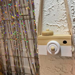 Cynzia white mini camera toy with hanging design for gentle handling.