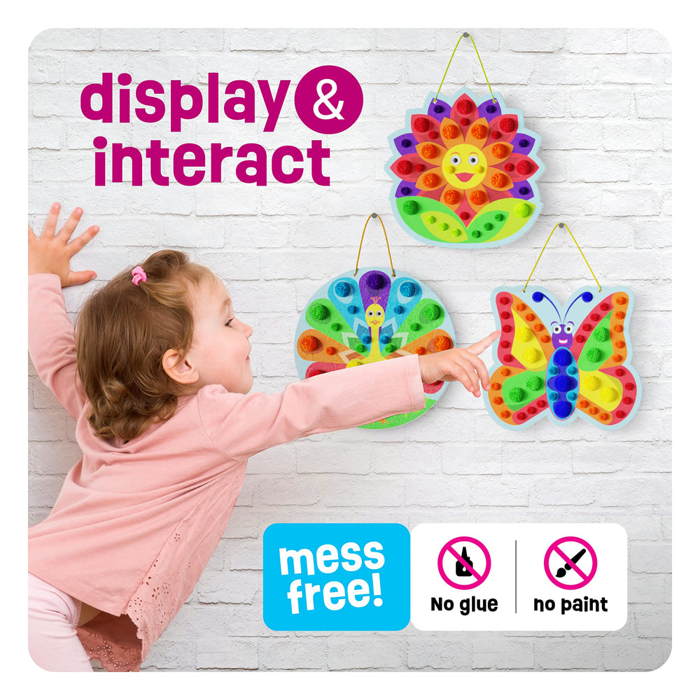 Dan & Darci Slot-board for pom poms enables mess-free pattern building.