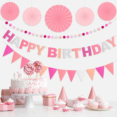Danadia pink felt pom-poms add soft color and texture to any party display.