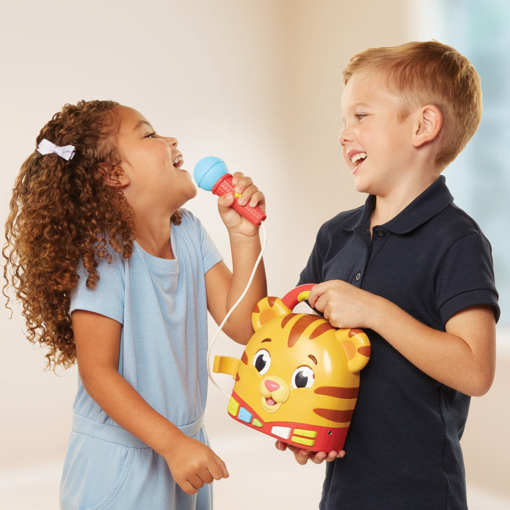 Kids recording and playing back their singing with Daniel Tiger's toy