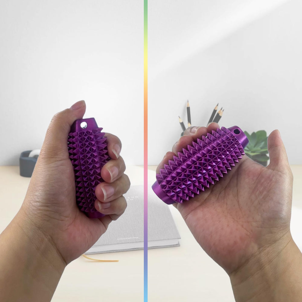 Pocket-size stress tool shown beside a coin for scale.