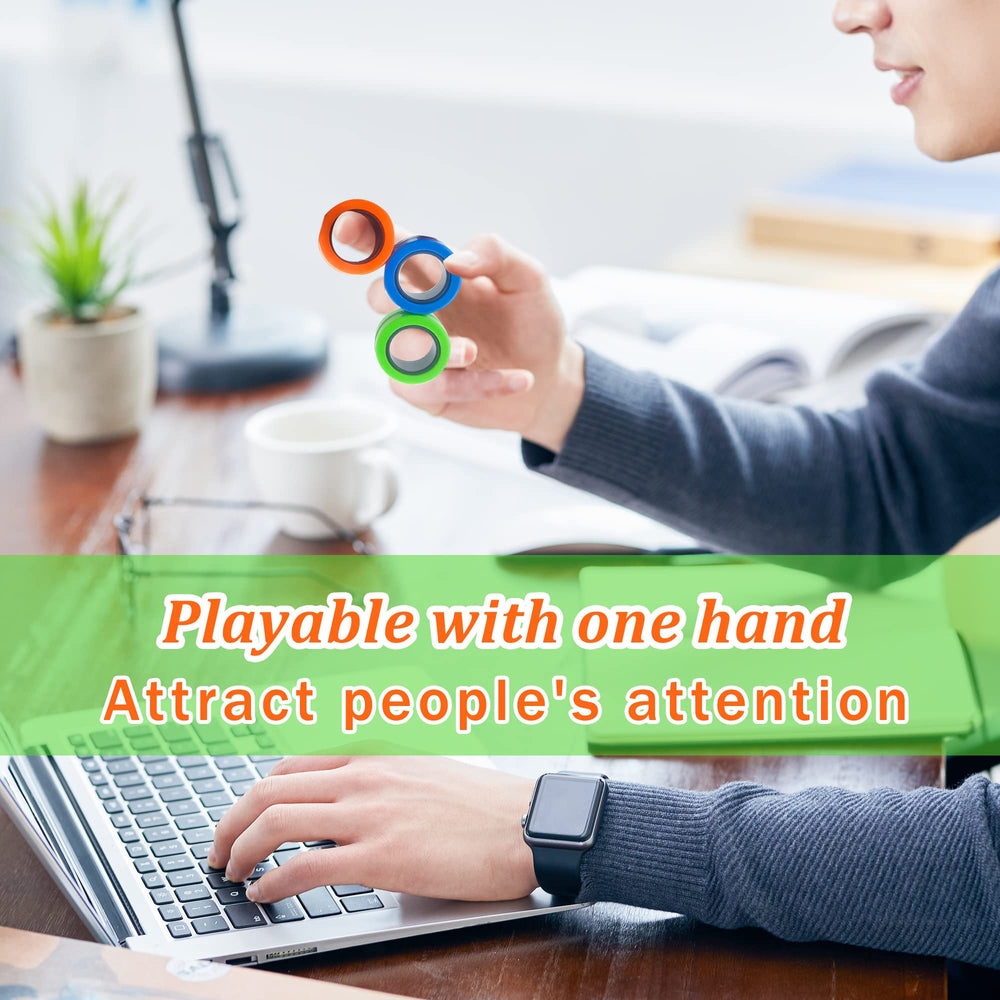 Dermasy fidget ring on desk for discreet stress relief during work.