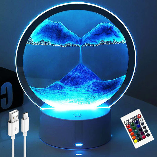 Desniltol 3D moving sand art frame in blue glows softly as a calming desk night light.