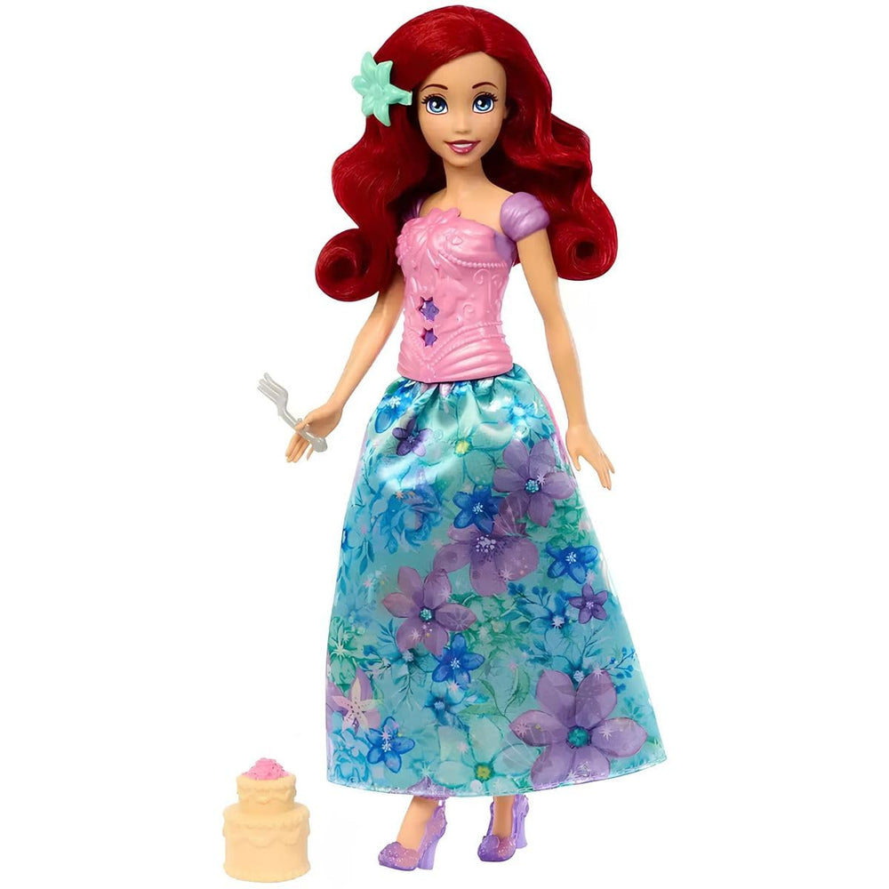 Final reveal shows Ariel doll in floral outfit with long hair and a snap-on bodice