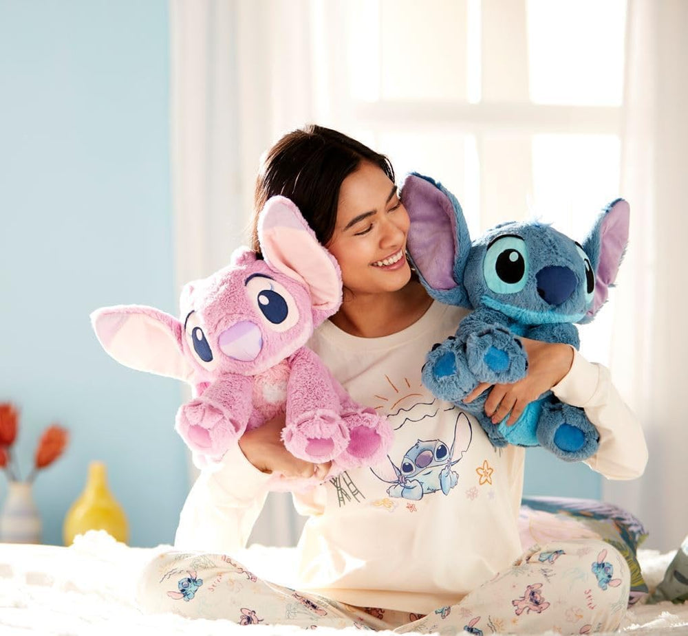 Disney Store Angel plush with antennae adds playful charm.