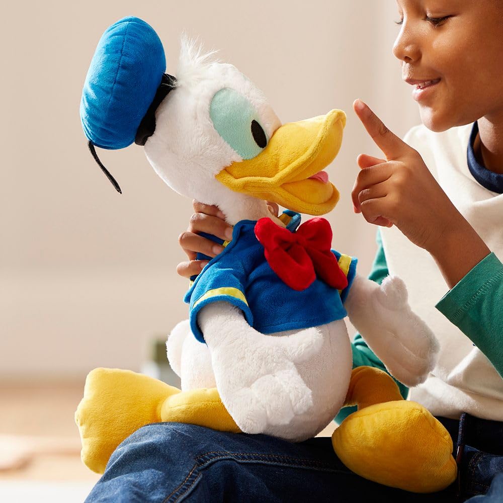 Disney Store Donald Duck plush in sailor suit with bow tie for adventures.