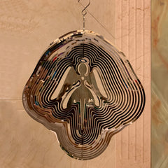 DJUAN Mirror-reflection Wind Spinner displays changing colors as light moves.