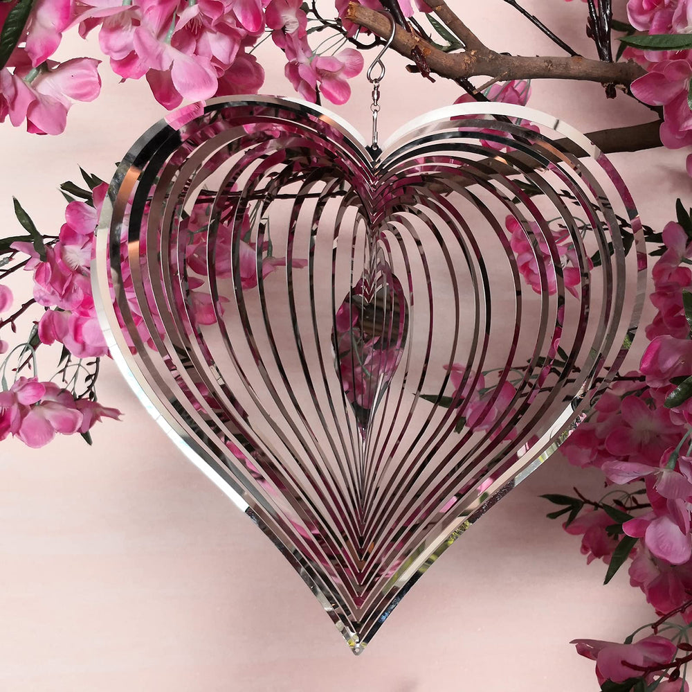 Close-up of DJUAN wind spinner heart design with glittering detail and breeze spins.