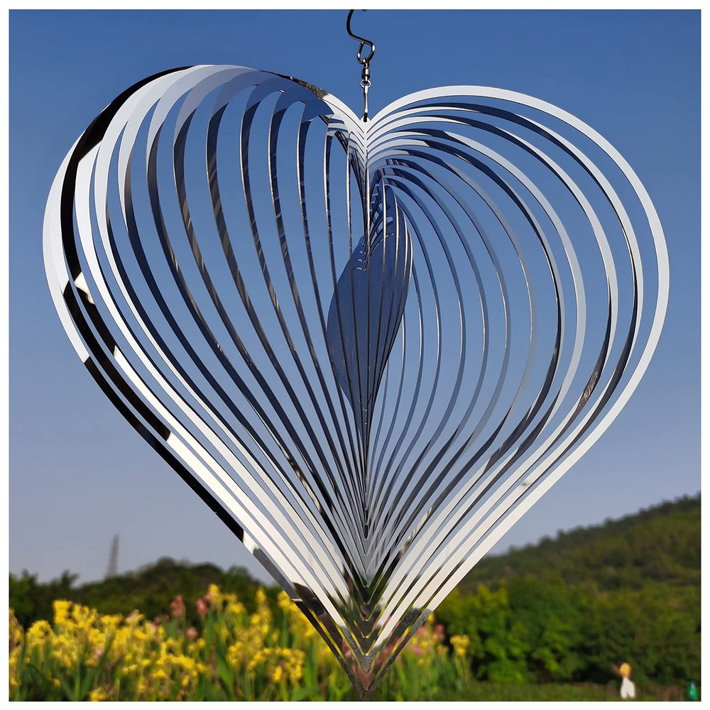 DJUAN silver heart wind spinner in full view enhances yard decor with motion.