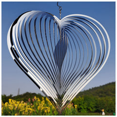 DJUAN silver heart wind spinner in full view enhances yard decor with motion.