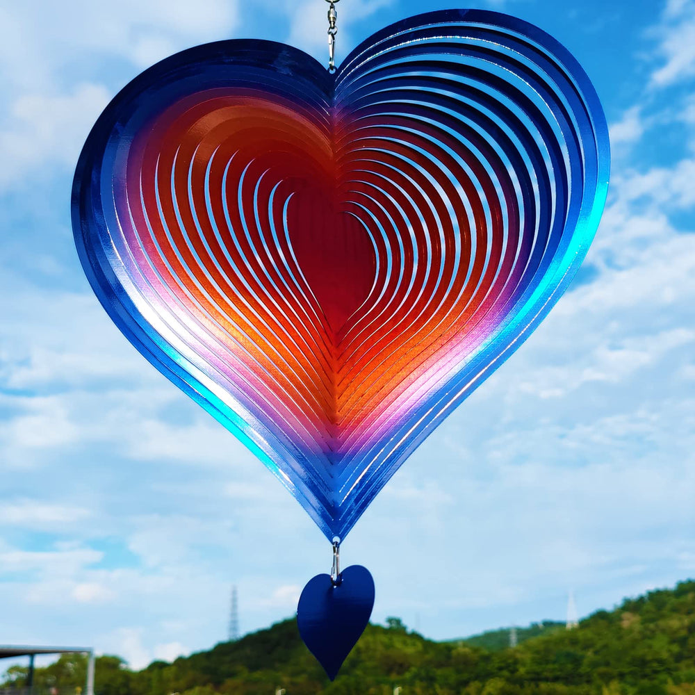 DJUAN wind spinner 12in love heart glistening in daylight for a romantic garden focal point.