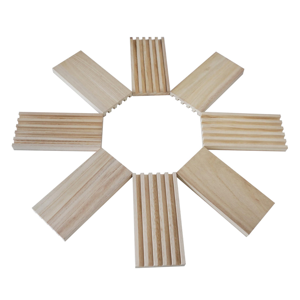 Eight wooden domino trays laid out on a table for display