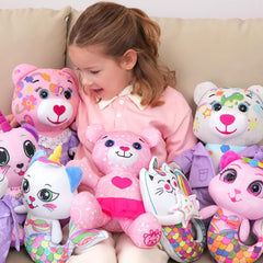 Child coloring the DRAWMYTOY plush toy with washable markers