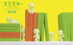 Dreams Smiski random styles 12-pack shown in a corner, decorative glow.