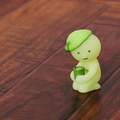 Dreams Smiski glow-in-the-dark living-hiding figure adds mysterious charm to a corner shelf