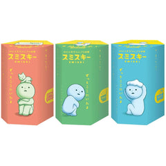 Dreams Smiski glow-in-the-dark living series figure glows softly on a shelf.