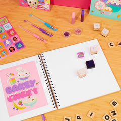 Stamps and inks from Gabby’s Dollhouse Scrapbook Kit for playful crafts
