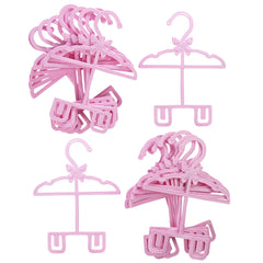 Dress Along Dolly 18-inch doll clothes hanger in use for outfits