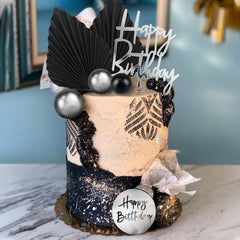 DRWATE ball toppers in silver and black create chic, modern cake accents.