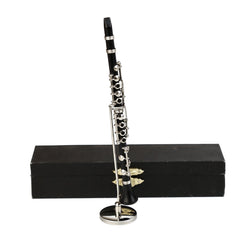 Dselvgvu miniature clarinet stand, a detailed resin-and-metal replica ideal for shelf display.